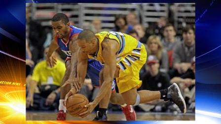Denver Nuggets Andre Miller (24) and Philadelphia 76ers Hollis Thompson chase a loose ball in the first half of an NBA basketball game Saturday Dec. 7, 2013, in Philadelphia. (AP Photo/H. Rumph Jr)