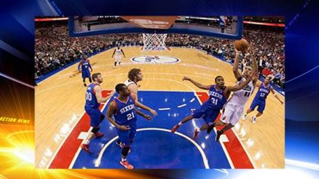 Portland Trail Blazers Nicolas Batum, front right, of France, shoots with Philadelphia 76ers Hollis Thompson guarding him during the first half of an NBA basketball game on Saturday, Dec. 14, 2013, in Philadelphia. (AP Photo/Chris Szagola)