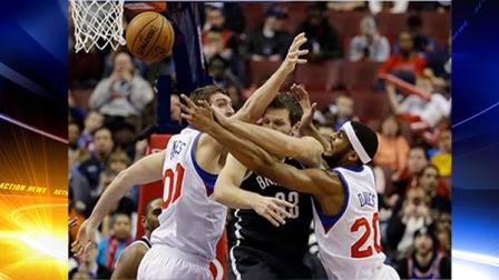 Brooklyn Nets Mirza Teletovic (33), of Bosnia, looses the ball under pressure from Philadelphia 76ers Spencer Hawes (00) and Brandon Davies (20) during the first half of an NBA basketball game, Friday, Dec. 20, 2013, in Philadelphia. (AP Photo/Matt Slocum)