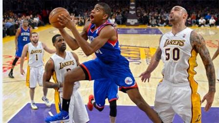 Philadelphia 76ers forward Hollis Thompson, center, puts up a shot as Los Angeles Lakers center Robert Sacre (50) defends and forward Shawne Williams, left of center, and guard Jordan Farmar looks on during the first half of an NBA basketball game, Sunday, Dec. 29, 2013, in Los Angeles. (AP Photo/Mark J. Terrill)