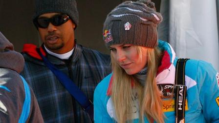 Lindsey Vonn is flanked by her boyfriend Tiger Woods as she leaves after an alpine ski, womens World Cup downhill, in Val DIsere, France, Saturday, Dec. 21, 2013. Lindsey Vonn is confident that her latest knee trouble will not stop her from competing at the Sochi Games in February. With boyfriend Tiger Woods watching from the bottom of the slope, Vonn missed a gate in Saturdays World Cup downhill at Val dIsere as her troublesome right knee buckled under her and gave way. The American was clearly distressed after skiing off course and looked close to tears. She didnt fall but grimaced as she pulled up, clutching her knee.
