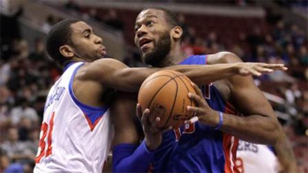 Pistons Greg Monroe, right, is fouled by Sixers Hollis Thompson (31) as he drives to the basket in the first half of an NBA basketball game on Friday, Jan. 10, 2014, in Philadelphia. (AP Photo/Laurence Kesterson)