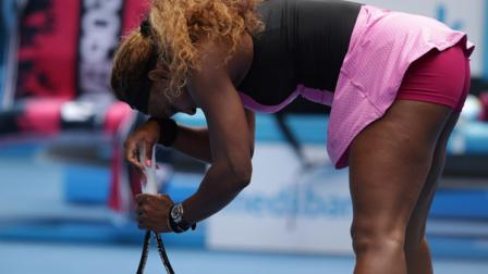 Serena Williams of the U.S. rests on her racket during her fourth round loss to Ana Ivanovic of Serbia at the Australian Open tennis championship in Melbourne, Australia, Sunday, Jan. 19, 2014.(AP Photo/Aaron Favila)