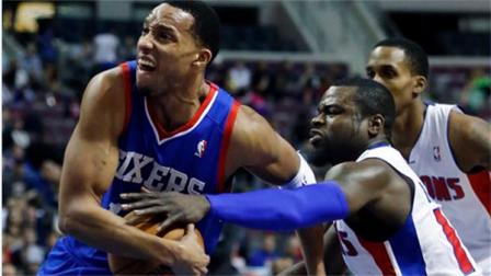 Detroit Pistons guard Will Bynum, right, tries to steal the ball as Philadelphia 76ers forward Evan Turner drives the lane during the first half of an NBA basketball game Saturday, Feb. 1, 2014, in Auburn Hills, Mich. (AP Photo/Duane Burleson)