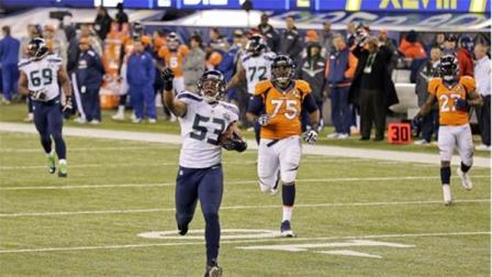 Seattle Seahawks outside linebacker Malcolm Smith (53) reacts as he returns an interception for a touchdown against the Denver Broncos during the first half of the NFL Super Bowl XLVIII football game, Sunday, Feb. 2, 2014, in East Rutherford, N.J. (AP Photo/Gregory Bull)