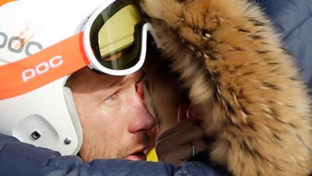 Mens super-G joint bronze medal winner Bode Miller of the United States is consoled by his wife, Morgan, at the Sochi 2014 Winter Olympics, Sunday, Feb. 16, 2014, in Krasnaya Polyana, Russia. (AP Photo/Christophe Ena)