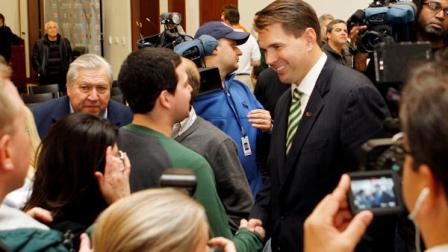 Miami head coach Al Golden, right, greets guests after a news conference in Coral Gables, Fla., Monday, Dec. 13, 2010. Golden was introduced to the Hurricanes community on Monday evening. (AP Photo/Alan Diaz)