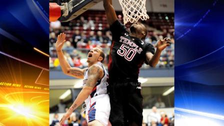 Duquesne s Bill Clark has a shot blocked by Temples Michael Eric, right, in the first half of an NCAA college basketball game in Pittsburgh, Saturday, Jan. 15, 2011. Duquesne limited No. 19 Temple to 31 percent shooting in winning its sixth consecutive game, 78-66 on Saturday. Clark scored 22 points. (AP Photo/John Heller)