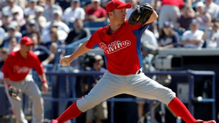 Philadelphia Phillies starting pitcher Roy Oswalt winds up in the first inning of a spring training baseball game against the New York Yankees at Steinbrenner Field in Tampa, Fla., Monday, March 7, 2011. (AP Photo/Kathy Willens)