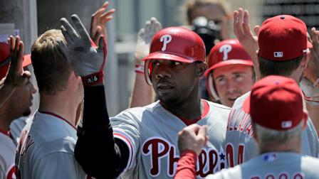 Philadelphia Phillies Ryan Howard is congratulated by teammates after hitting a two-run home run during the sixth inning of a baseball game against the Los Angeles Dodgers, Wednesday, Aug. 10, 2011, in Los Angeles. (AP Photo/Mark J. Terrill)