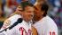Philadelphia Phillies John Kruk, left, is kissed...