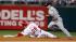 Philadelphia Phillies Chase Utley (26) is out at...