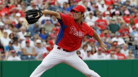 Philadelphia Phillies starting pitcher Cole Hamels winds up against the Tampa Bay Rays in their spring training baseball game in Clearwater, Fla., Thursday, March 29, 2012. (AP Photo/Kathy Willens)