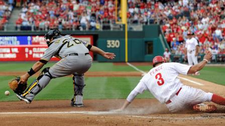 Philadelphia Phillies Hunter Pence (3) slides past Pittsburgh Pirates Rod Barajas for a run in the first inning of a baseball game, Monday, June 25, 2012, in Philadelphia. (AP Photo/Michael Perez)