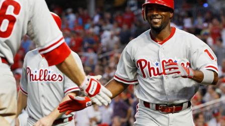 Philadelphia Phillies Jimmy Rollins (11) celebrates with teammates after Rollins hit a two-run home run in the fourth inning of a baseball game against the Washington Nationals, Tuesday, July 31, 2012, in Washington. (AP Photo/Carolyn Kaster)