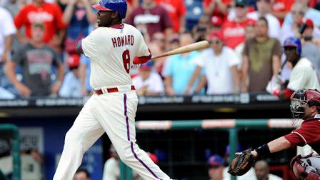 Philadelphia Phillies Ryan Howard, left, watches his game-winning hit in front of Arizona Diamondbacks Miguel Montero in the ninth inning of a baseball game on Sunday, Aug. 5, 2012, in Philadelphia. The Phillies won 5-4. (AP Photo/Michael Perez)