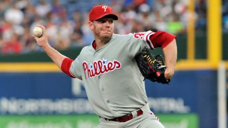 Philadelphia Phillies starter Roy Halladay delivers to the Atlanta Braves during the first inning of a baseball game on Friday, Aug. 31, 2012, at Turner Field in Atlanta. (AP Photo/Gregory Smith)