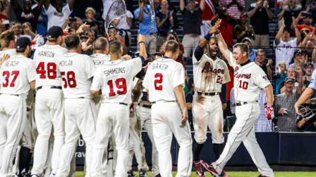 Atlanta Braves Chipper Jones (10) celebrates his three-run, walk-off home run in the ninth inning of a baseball game against the Philadelphia Phillies, Sunday, Sept. 2, 2012, in Atlanta. The Braves won 8-7. (AP Photo/Daniel Shirey)