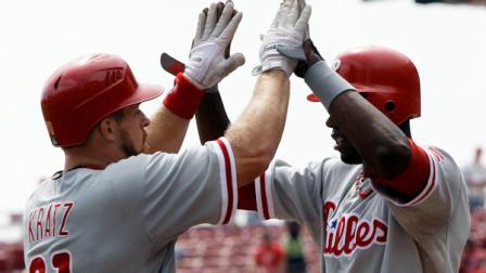 Philadelphia Phillies Erik Kratz (31) is congratulated by John Mayberry Jr. after hitting a three-run home run in the second inning of a baseball game against the Cincinnati Reds, Wednesday, Sept. 5, 2012, in Cincinnati. (AP Photo/Al Behrman)