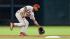 Philadelphia Phillies shortstop Jimmy Rollins fields a ground ball hit by Houston Astros' Jimmy Paredes during the third inning of a baseball game on Sunday, Sept. 16, 2012, in Houston. Paredes was safe at first with a single. (AP Photo/David J. Phillip)