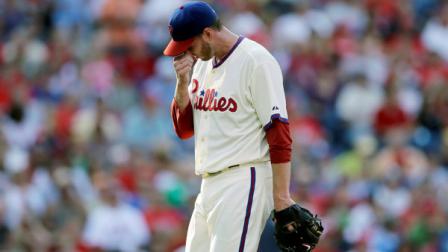 Philadelphia Phillies starting pitcher Roy Halladay wipes his face as he walks off the field after being pulled in the second inning of a baseball game against the Atlanta Braves, Saturday, Sept. 22, 2012, in Philadelphia. (AP Photo/Matt Slocum)