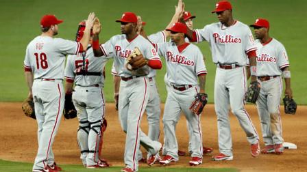 Philadelphia Phillies players celebrate their 9-5 win against the Miami Marlins baseball game in Miami, Saturday, Sept. 29, 2012. (AP Photo/Alan Diaz)