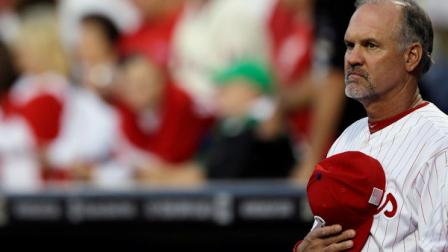 Philadelphia Phillies Ryne Sandberg listens to the national anthem before a baseball game against the Miami Marlins, Tuesday, Sept. 11, 2012, in Philadelphia. (AP Photo/Matt Slocum)