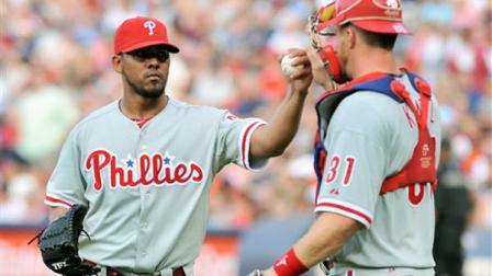 Philadelphia Phillies closer Antonio Bastardo, left, celebrates their win against the Atlanta Braves with Phillies catcher Erik Kratz (31) at a baseball game Saturday, Sept. 1, 2012, at Turner Field in Atlanta. The Phillies won 5-1. (AP Photo/Gregory Smith)
