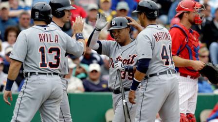 Detroit Tigers Alex Avila (13), Don Kelly and Victor Martinez (41) congratulate Ramon Santiago (39) on Santiagos third-inning grand slam off Philadelphia Phillies starting pitcher Roy Halladay in their spring training baseball game in Clearwater, Fla., Tuesday, March 12, 2013. Phillies catcher Erik Katz stands at right. (AP Photo/Kathy Willens)