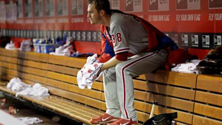 Philadelphia Phillies starting pitcher Kyle Kendrick sits in the dugout in the seventh inning of a baseball game against the Cincinnati Reds, Tuesday, April 16, 2013, in Cincinnati. Kendrick pitched seven innings before leaving the game with the score tied 0-0. (AP Photo/Al Behrman)
