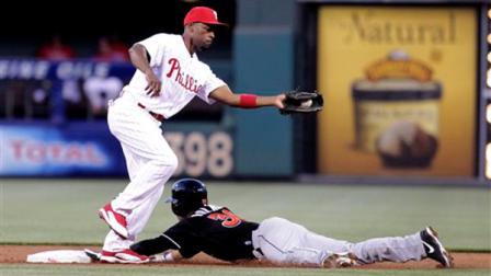 Miami Marlins Placido Polanco slides safely into second as Philadelphia Phillies Jimmy Rollins fields the ball in the third inning of a baseball game Saturday, May 4, 2013, in Philadelphia. (AP Photo/H. Rumph Jr)