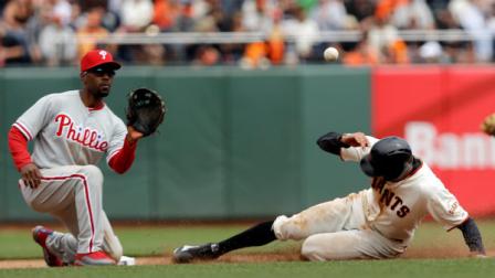 San Francisco Giants Hunter Pence, right, steals second base against Philadelphia Phillies shortstop Jimmy Rollins during the seventh inning of a baseball game, Wednesday, May 8, 2013, in San Francisco. (AP Photo/Marcio Jose Sanchez)