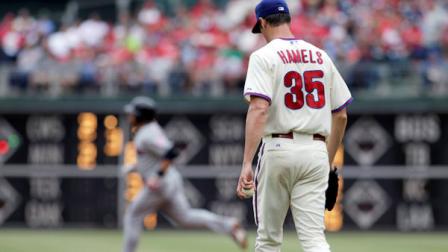 Philadelphia Phillies starting pitcher Cole Hamels walks back to the mound as Cleveland Indians Mike Aviles round the bases after hitting a solo home run in the fourth inning of a interleague baseball game Wednesday, May 15, 2013, in Philadelphia. (AP Photo/H. Rumph Jr)