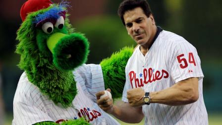 Actor Lou Ferrigno, right, poses with the Philadelphia Phillies mascot, the Phillie Phanatic, after Ferrigno threw out a ceremonial first pitch before an interleague baseball game between the Phillies and the Boston Red Sox, Thursday, May 30, 2013, in Philadelphia. (AP Photo/Matt Slocum)