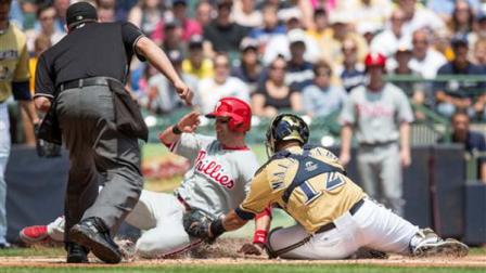 Milwaukee Brewers Martin Maldonado puts the tag on Philadelphia Phillies Michael Young during the first inning of a baseball game on Sunday, June 9, 2013, in Milwaukee. (AP Photo/Tom Lynn)