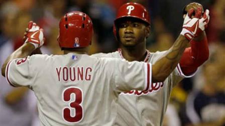 Philadelphia Phillies Domonic Brown, right, and teammate Delmon Young (3) celebrate Youngs two-run home against the San Diego Padres during the eighth inning to tie the game in a baseball game Wednesday, June 26, 2013, in San Diego. (AP Photo/Gregory Bull)