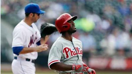 Philadelphia Phillies Jimmy Rollins reacts after being thrown out at first base as New York Mets Josh Satin handles the ball during the ninth inning of a baseball game Saturday, July 20, 2013, in New York. The Mets won the game 5-4. (AP Photo/Frank Franklin II)