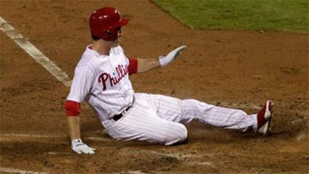 Philadelphia Phillies Chase Utley scores against the New York Mets in the sixth inning of a baseball game on Saturday, Sept. 21, 2013, in Philadelphia. (AP Photo/H. Rumph Jr)