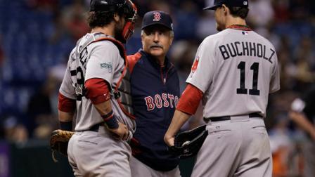 Boston Red Sox pitching coach Bob McClure, center, talks to catcher Jarrod Saltalamacchia, left, and starting pitcher Clay Buchholz, right, during a baseball game against the Tampa Bay Rays Tuesday, May 16, 2012, in St. Petersburg, Fla. (AP Photo/Chris OMeara)