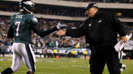 Philadelphia Eagles quarterback Michael Vick, left, and coach Andy Reid celebrate after a touchdown in the first half of an NFL football game against the Houston Texans, Thursday, Dec. 2, 2010, in Philadelphia. (AP Photo/Matt Slocum)