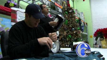 Philadelphia Eagles tight end Brent Celek signs a football in Deptford, New Jersey on Dec. 20, 2010.