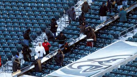 Work crews remove snow from the stands Lincoln Financial Field, the home of the Philadelphia Eagles NFL football team, in Philadelphia on Monday, Dec. 27, 2010. The game between the Eagles and the Minnesota Vikings was postponed from Sunday night to Tuesday night because of a winter storm. (AP Photo/Matt Rourke)