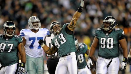 Philadelphia Eagles defensive end Jason Babin (93) reacts after his sack of Dallas Cowboys quarterback Tony Romo, as defensive tackle Cullen Jenkins (97) and defensive tackle Mike Patterson (98) stand nearby in the first half of an NFL football game Sunday, Oct. 30, 2011 in Philadelphia. (AP Photo/Michael Perez)