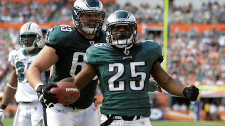 Philadelphia Eagles running back LeSean McCoy (25) celebrates a touchdown with teammate Danny Watkins during the first half of an NFL football game against the Miami Dolphins, Sunday, Dec. 11, 2011, in Miami. (AP Photo/Lynne Sladky)