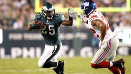 Philadelphia Eagles running back LeSean McCoy (25) runs with the ball as New York Giants defensive end Osi Umenyiora (72) defends on the play during the first half of an NFL football game Sunday, Sept. 30, 2012, in Philadelphia. (AP Photo/Mel Evans)