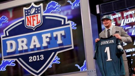 Tackle Lane Johnson from Oklahoma holds up the team jersey after being selected fourth overall by the Philadelphia Eagles in the first round of the NFL football draft, Thursday, April 25, 2013 at Radio City Music Hall in New York. (AP Photo/Jason DeCrow)