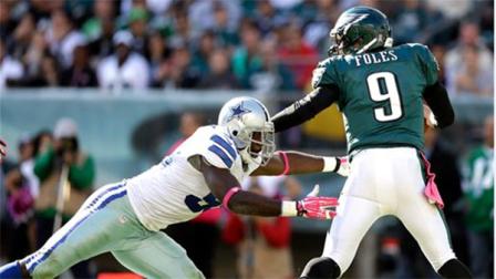 Philadelphia Eagles quarterback Nick Foles (9) avoids being sacked by Dallas Cowboys defensive end George Selvie (99) during the second half of an NFL football game, Sunday, Oct. 20, 2013, in Philadelphia. (AP Photo/Matt Rourke)