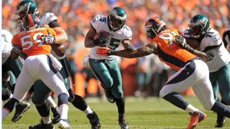 Philadelphia Eagles running back LeSean McCoy (25) takes the ball through a hole against Denver Broncos linebacker Danny Trevathan (59) and defensive end Robert Ayers (91) in the first quarter of an NFL football game, Sunday, Sept. 29, 2013, in Denver. (AP Photo/Jack Dempsey)