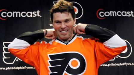 Philadelphia Flyers right wing Jaromir Jagr, from the Czech Republic, tries on a Flyers jersey during an NHL hockey media availability, Saturday, Sept. 17, 2011, in Voorhees, N.J. Jagr signed a one-year contract with the Flyers.
