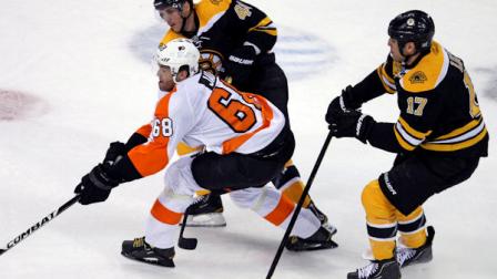 Philadelphia Flyers right wing Jaromir Jagr (68) skates between Boston Bruins center David Krejci, top left, and left wing Milan Lucic, right, during the first period of an NHL hockey game in Boston, Thursday, Oct. 6, 2011. (AP Photo/Charles Krupa)